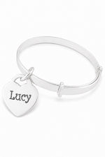 Smooth sterling silver bangle with Lucy oxidised engraving