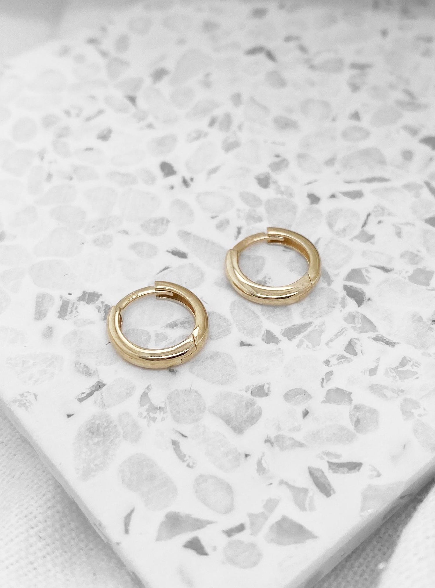 Aurelia Teeny Tiny Huggie Hoop Earrings in 9ct Gold