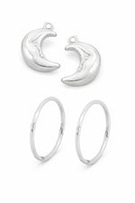 Sterling silver crescent moon charms with sleeper earrings on a white background