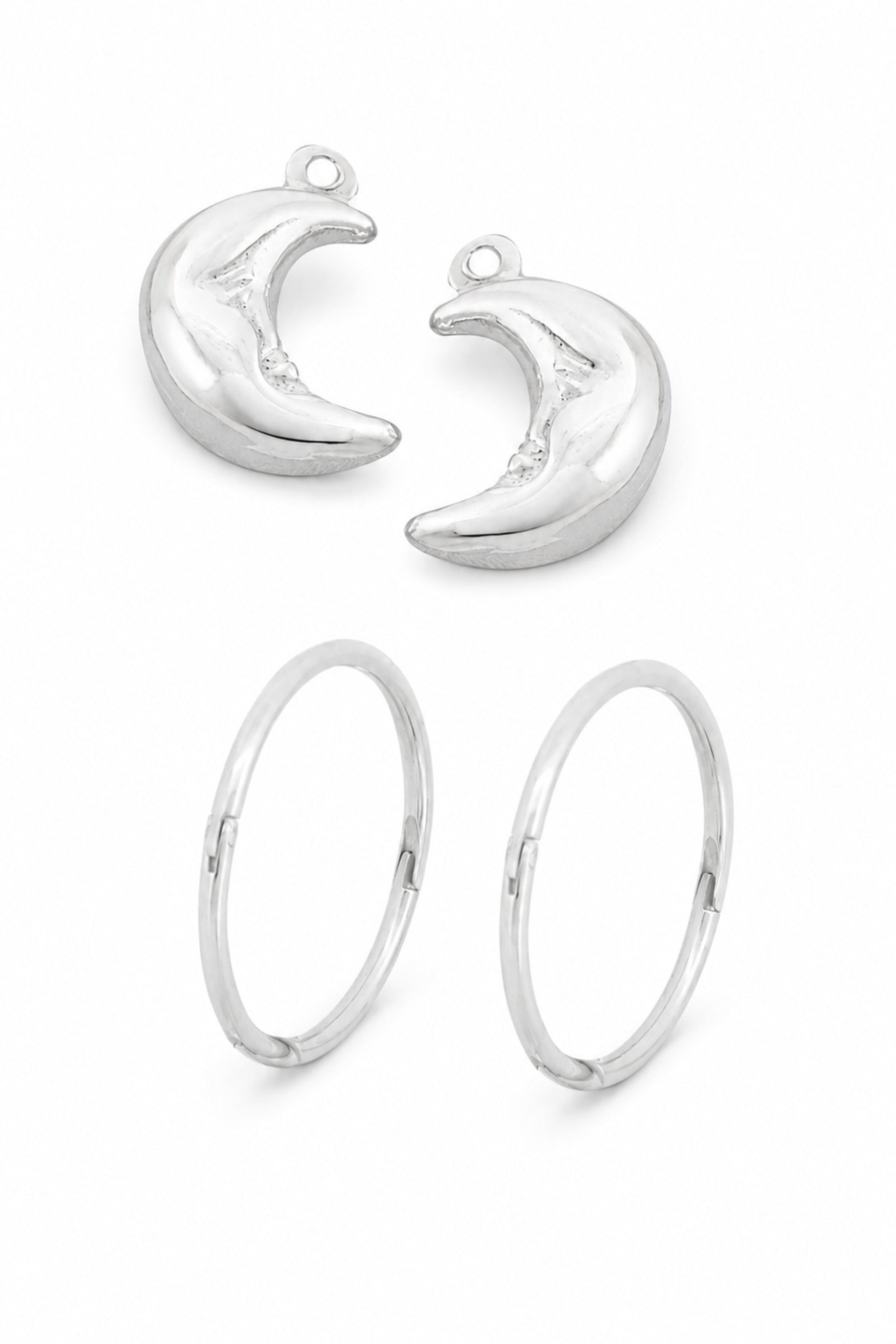 Sterling silver crescent moon charms with sleeper earrings on a white background