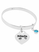 Sterling silver 5mm expanding bangle with personalised Nikaila heart tag and blue birthstone on white